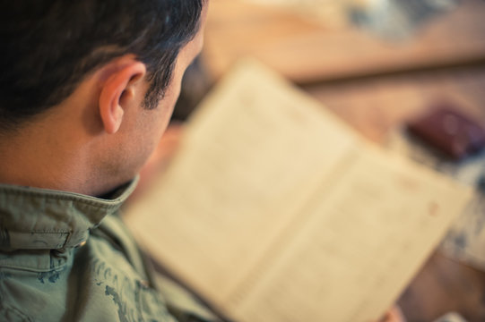 Man Looking At The Menu