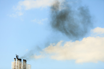 Vessel chimneys releasing smoke.