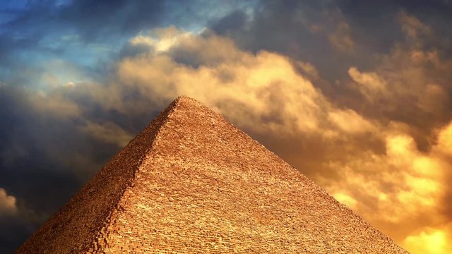 Pyramid With Golden Clouds Passing Above