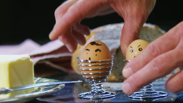  Close up of a happy healthy breakfast - boiled eggs with happy faces