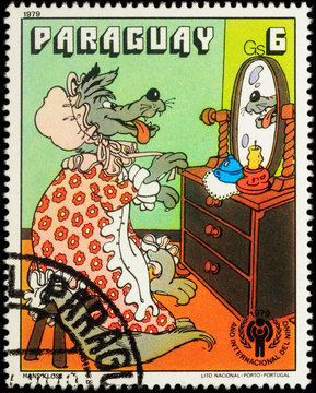 Wolf and a mirror - a scene from a fairy tale on postage stamp