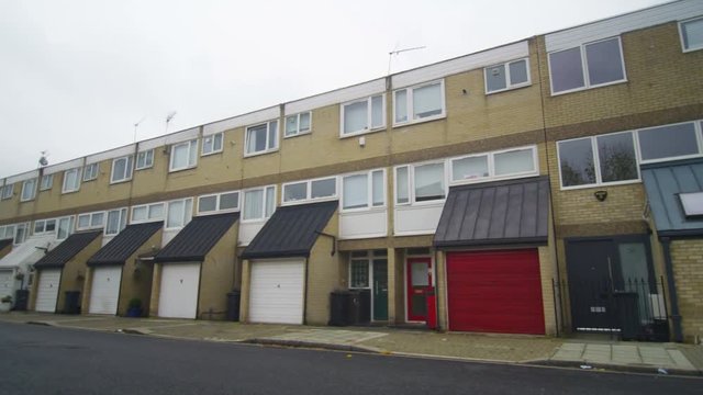  Exterior view of residential terraced housing in a London Suburb.
