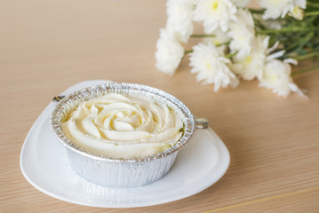 Milk cake with white flower background.