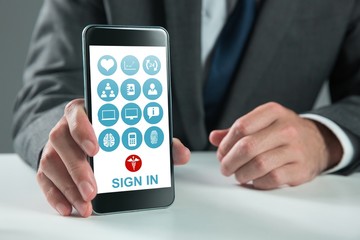 Composite image of businessman using smartphone