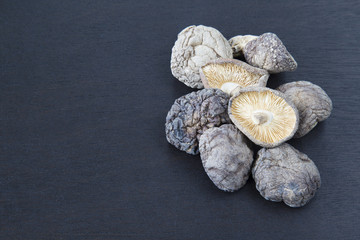 Dried Chinese mushroom with copyspace on wooden background