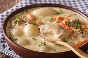 Belgian WATERZOOI soup with chicken close up in a bowl. horizontal

