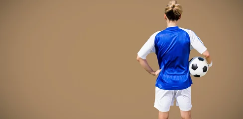 Fotobehang Composite image of rear view of woman football player posing  © vectorfusionart