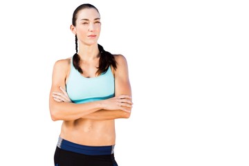 Sporty woman posing with her arms crossed