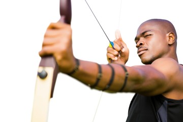 Front view of sportsman practising archery 