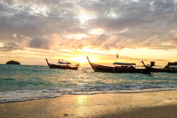 Sunrise at ocean with fishery boat