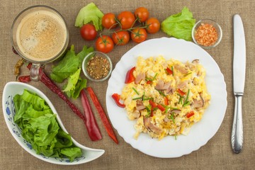 Homemade breakfast with a cup of coffee.Fresh scrambled eggs with bacon and vegetables. Breakfast athletes. Preparing eggs. Protein diet. Eggs in different kinds of preparations.
