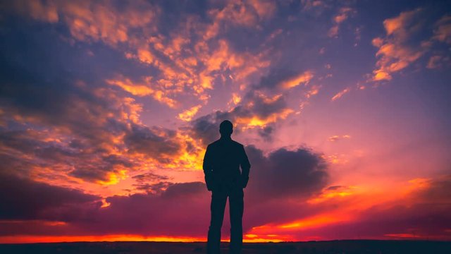 4 in 1! The man stand on the background of cloud flow. Time lapse