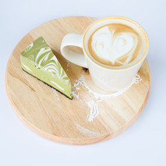 A cup of cafe latte and cake