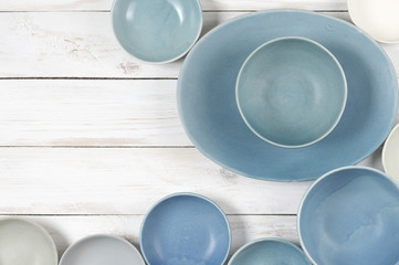 Blue crockery on white wood