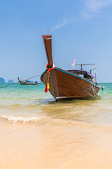 Fototapeta na wymiar Traditional long-tail boat on the Ao Nang beach, Krabi, Thailand