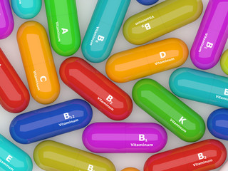 colorful  pills with vitamins lying on table