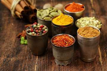 variety of spices (saffron, paprika, pepper, fennel, cinnamon, turmeric, nutmeg) © Olga Kriger