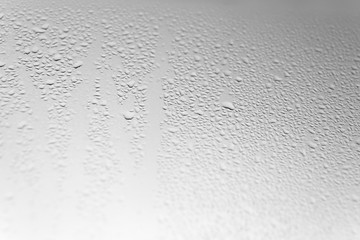 Many Water Drops on Grey Glass