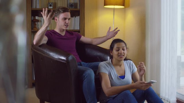  Relationship issues - attractive young couple having a disagreement at home