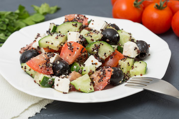 Fresh salad with black quinoa, tomatoes, cucumbers and feta chee
