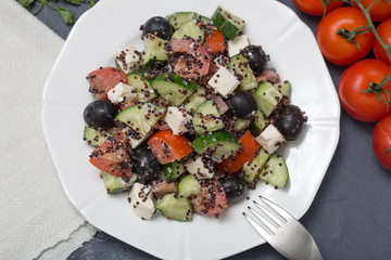 Fresh salad with black quinoa, tomatoes, cucumbers and feta chee