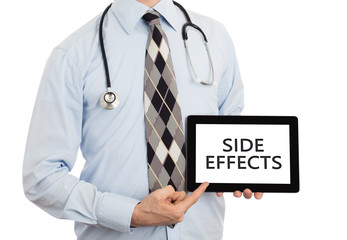 Doctor holding tablet - Side effects
