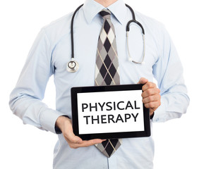 Doctor holding tablet - Physical therapy