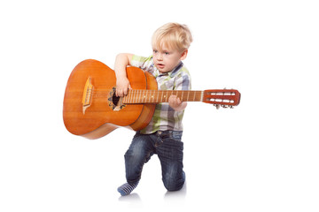 Cute boy with classical guitar. Isolated on white background