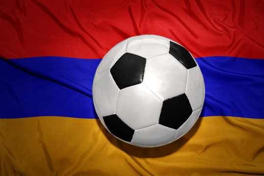 black and white football ball on the national flag of armenia