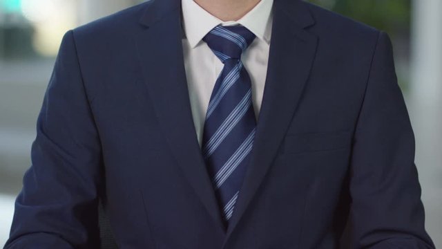  Close up of unrecognisable businessman tearing up a contract