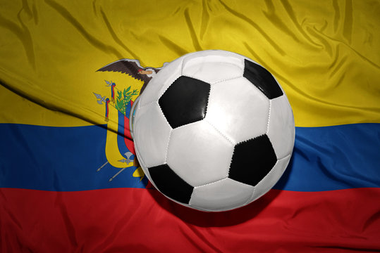 black and white football ball on the national flag of ecuador