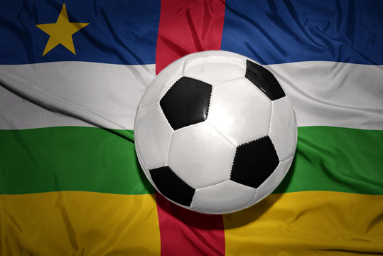 black and white football ball on the national flag of central african republic
