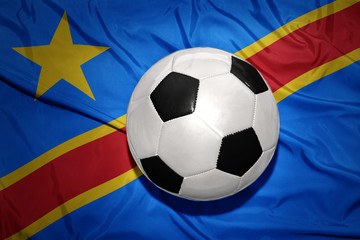 Fototapeta premium black and white football ball on the national flag of democratic republic of the congo