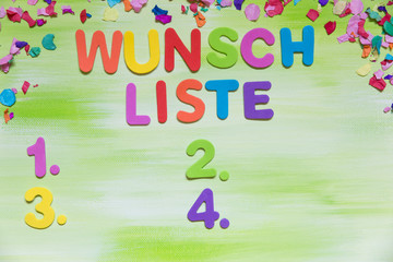 colorful letters and confetti, german word, wish list