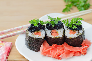 Rolls with salmon, caviar and pickled ginger