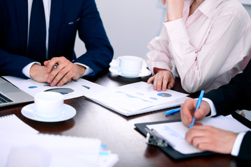 Group of business people at meeting  discussing financial results