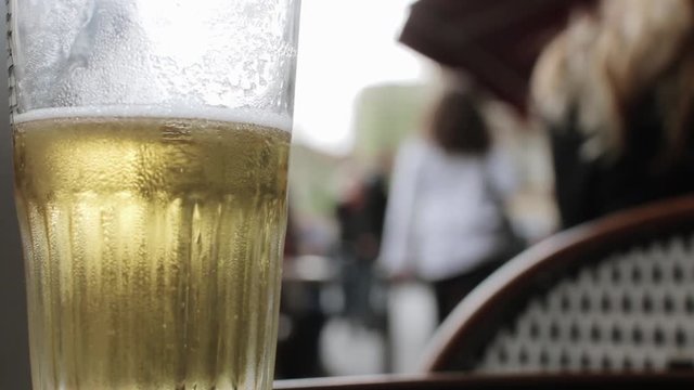 Beer Standing In Restaurant Table Close Shot. Sitting on the terrace of a restaurant drinking beer in Paris, France