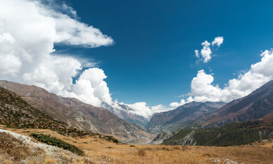 Mountain pastures with dramatic sky.