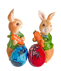 Easter rabbits with colored traditional easter eggs, quails egg