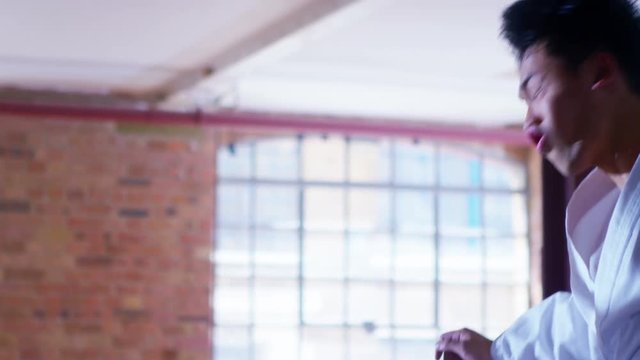 Outnumbered martial arts fighter skillfully uses nunchaku to beat opponents