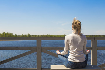 Woman sitting in lotus position