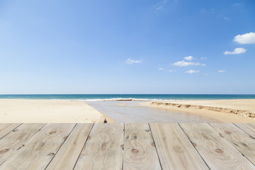 Fototapeta na wymiar Wood floor with beach and tropical sea ,beautiful scenery backgr