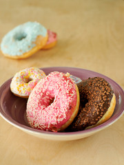 Donuts, cake with a hole and a sweet topping