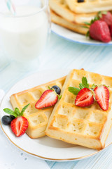 Fototapeta na wymiar Belgian waffles with strawberries