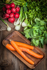 Fresh vegetables on a wooden table.
