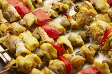 appetizer skewers the fish with vegetables, olives