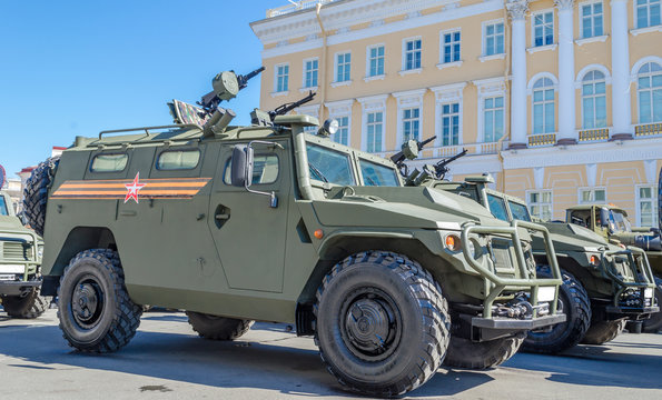 Armoured military vehicle with weapons on the street