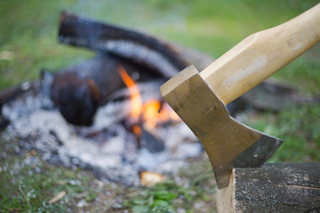 Camping in the woods with a fire ax in the summer.