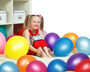 Fototapeta na wymiar portrait of a little girl playing with balls