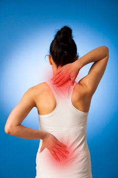 Woman having pain in her back - back injury